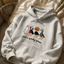 A cozy embroidered sweatshirt featuring adorable Halloween designs you'll love wearing all season.
